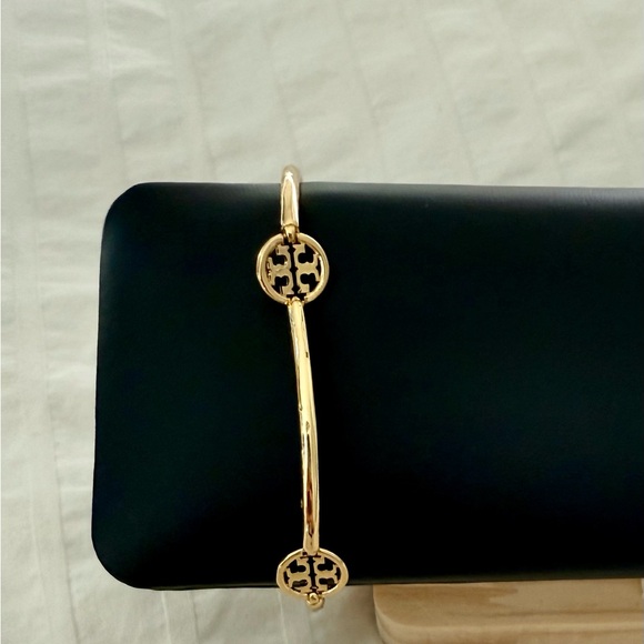 Tory Burch Gold Emblem Bangle with pouch - Picture 1 of 3
